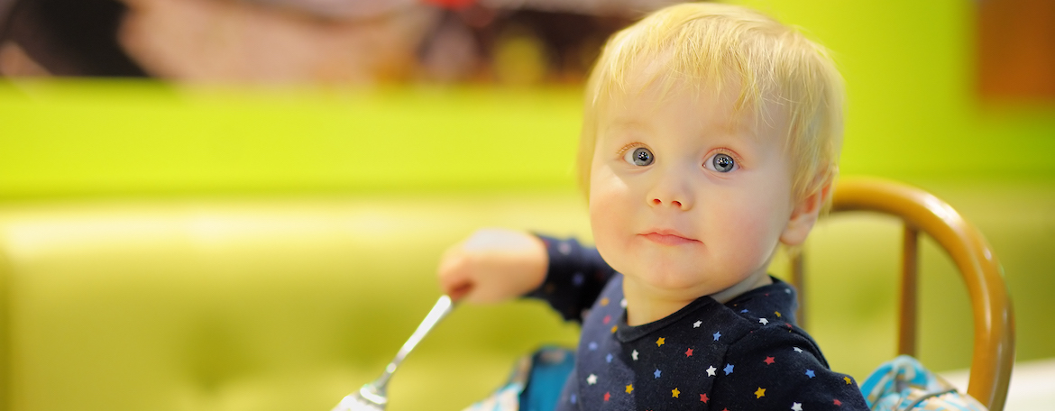 cute toddler boy at the indoors cafe