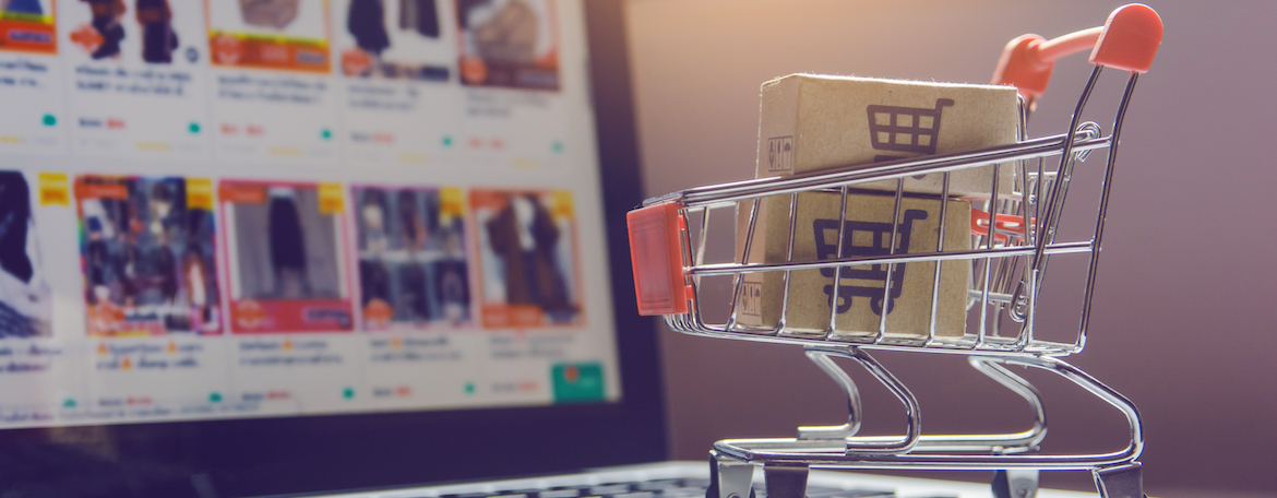 parcel with shopping cart logo in trolley on laptop